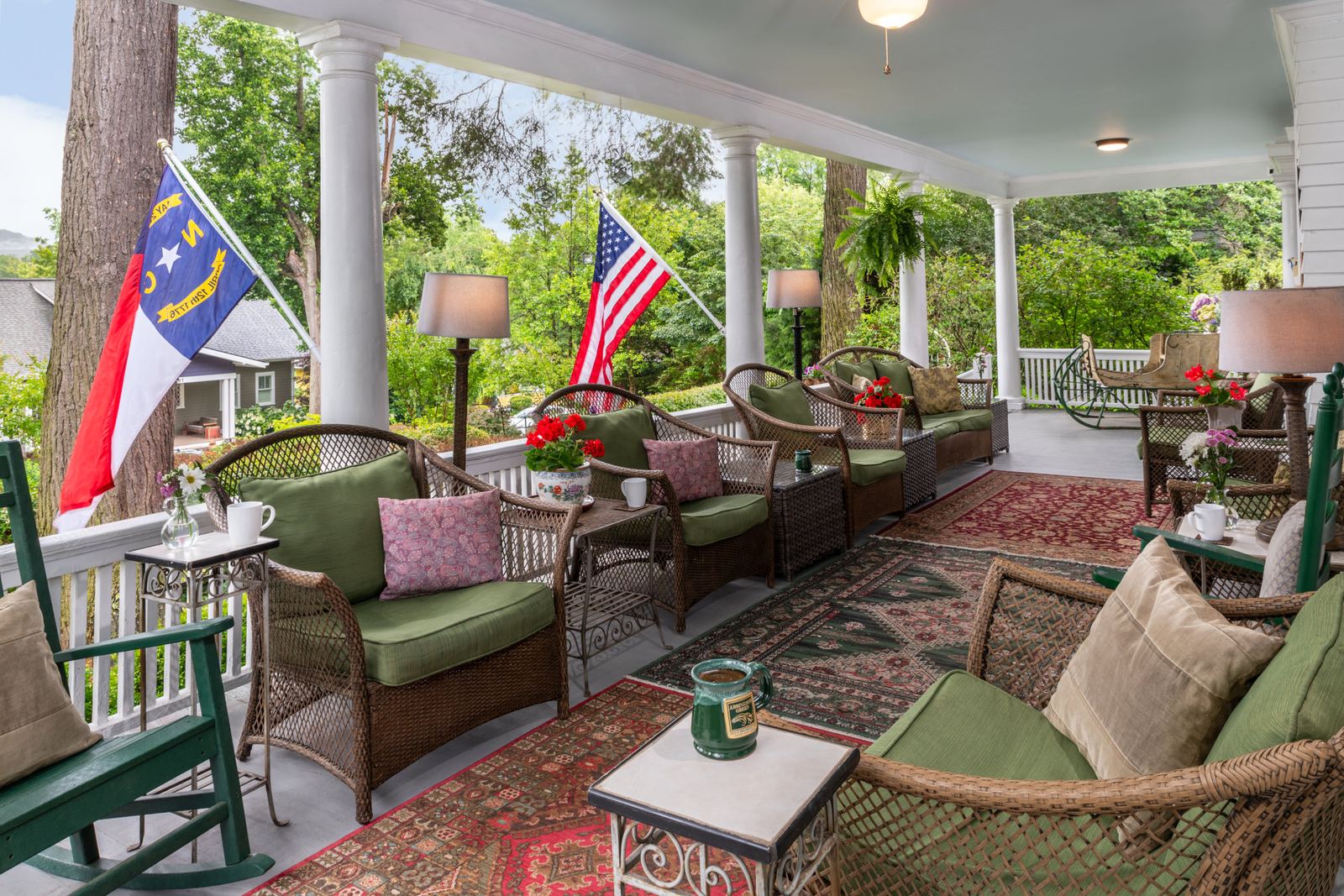 The wraparound porch at Abbington Green with rocking chairs